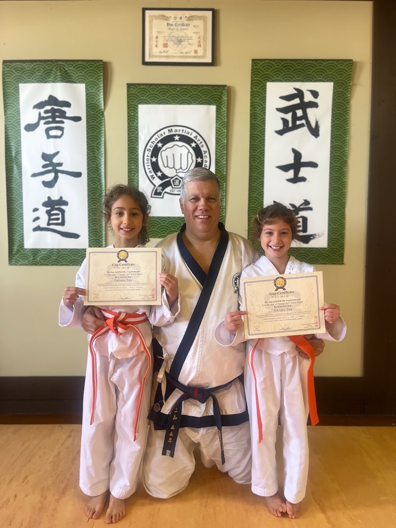 Master Daniel Segarra with students at belt graduation